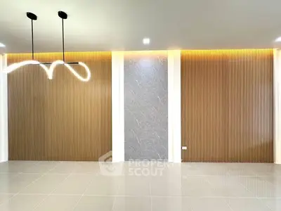 Modern interior with stylish lighting and textured wall panels