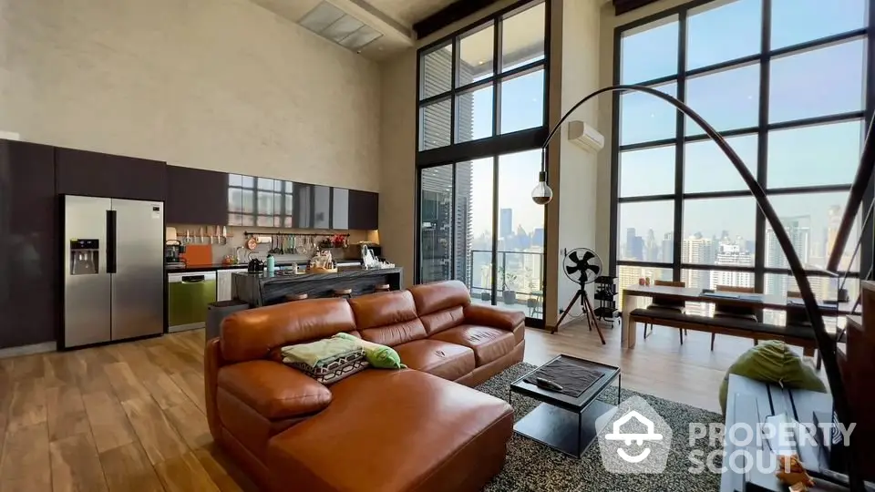 Luxurious open-plan living room with stunning city view and modern furnishings