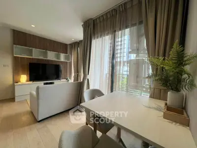 Modern living room with natural light and stylish decor in a contemporary apartment.
