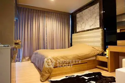 Luxurious bedroom with elegant decor and cozy ambiance, featuring a stylish bed and modern furnishings.