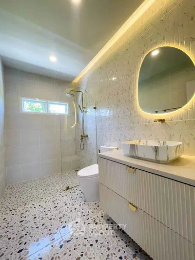 Modern bathroom with terrazzo flooring and stylish vanity