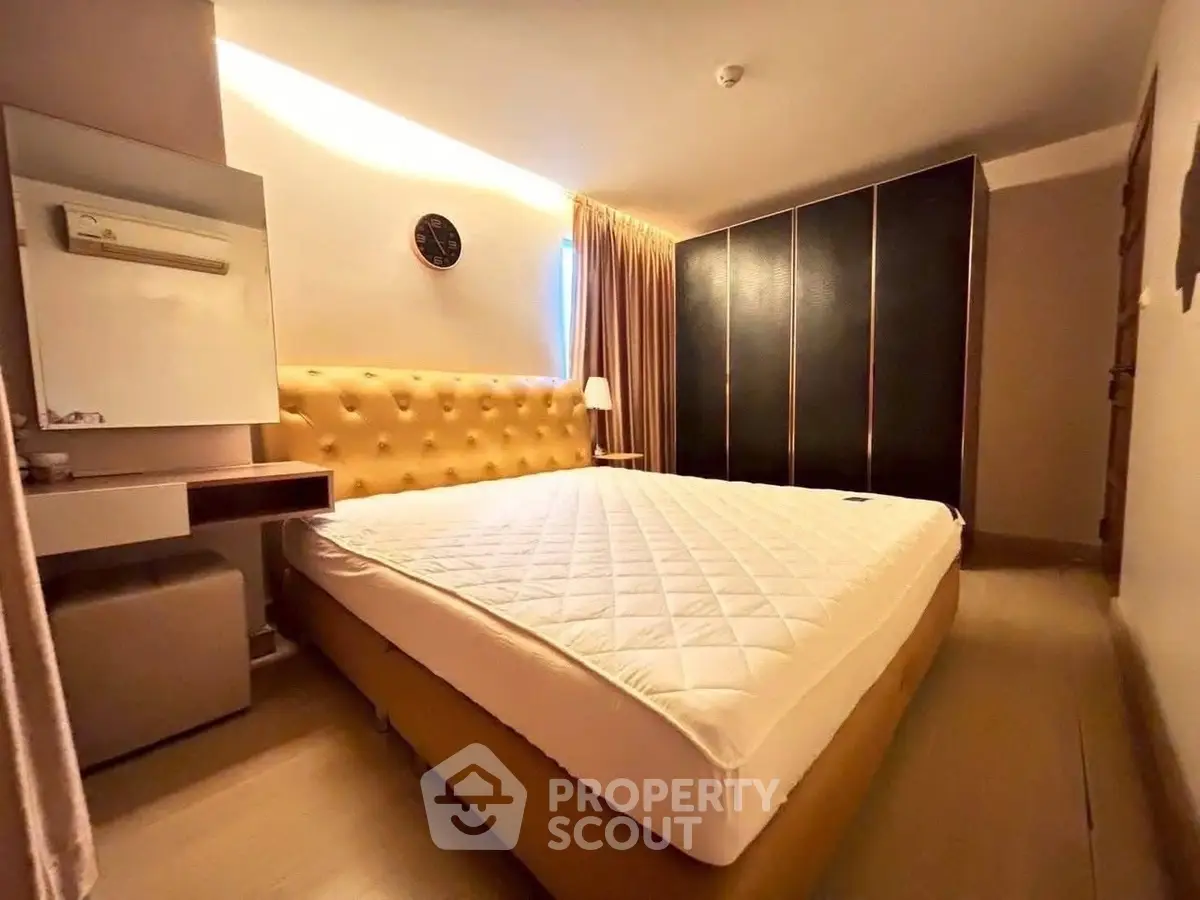 Spacious bedroom with modern design and ample storage space
