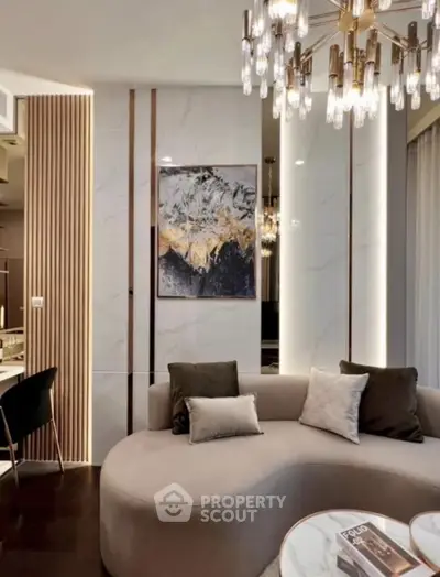 Luxurious modern living room with elegant chandelier and stylish decor