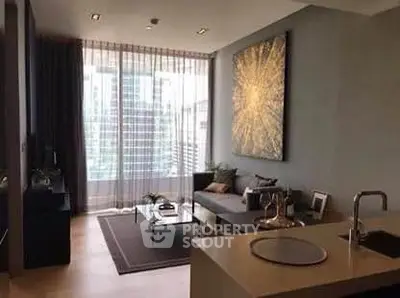 Modern living room with floor-to-ceiling windows and stylish decor in a high-rise apartment.