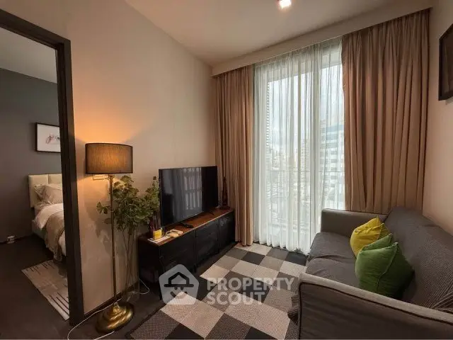 Cozy living room with modern decor and large window in stylish apartment