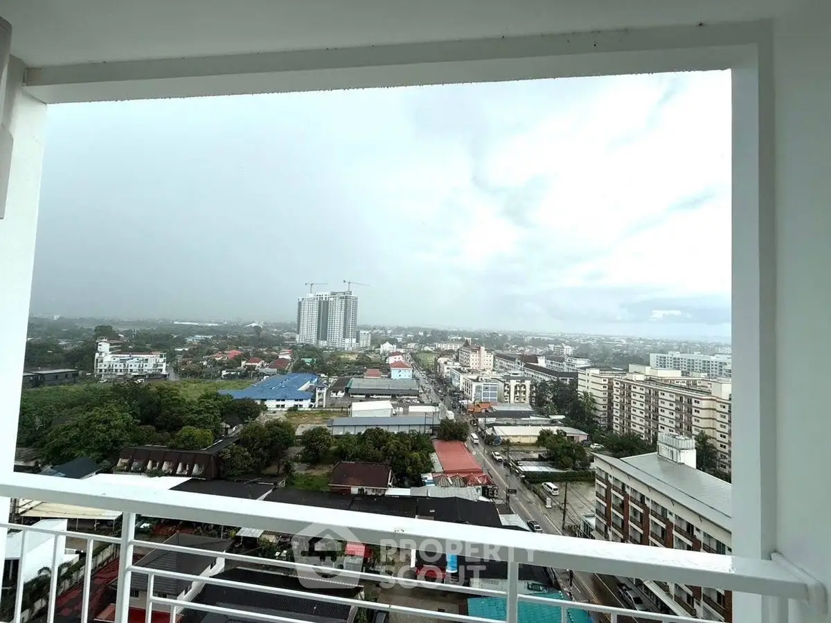 Stunning cityscape view from high-rise balcony with expansive skyline.