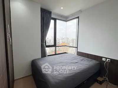 Modern bedroom with stunning city view and large windows