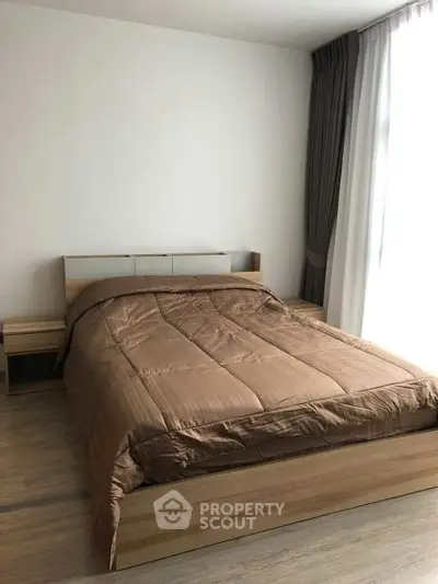 Cozy bedroom with modern wooden bed and natural light