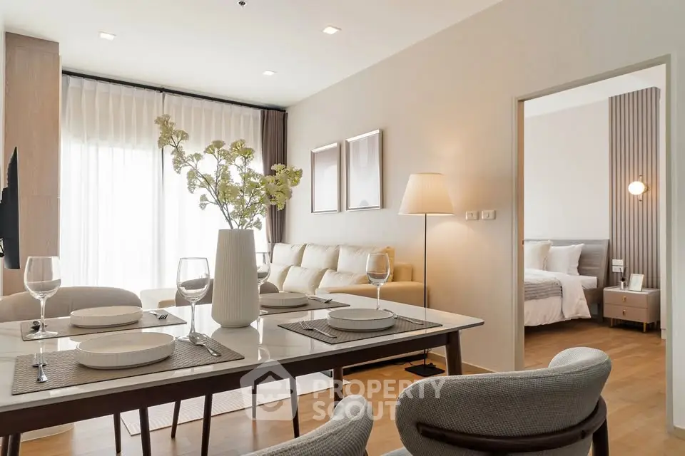 Elegant open-plan living and dining area with modern decor and natural light