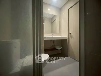 Modern bathroom with sleek design and large mirror