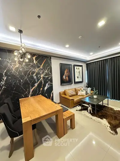 Modern living room with stylish decor and elegant dining area