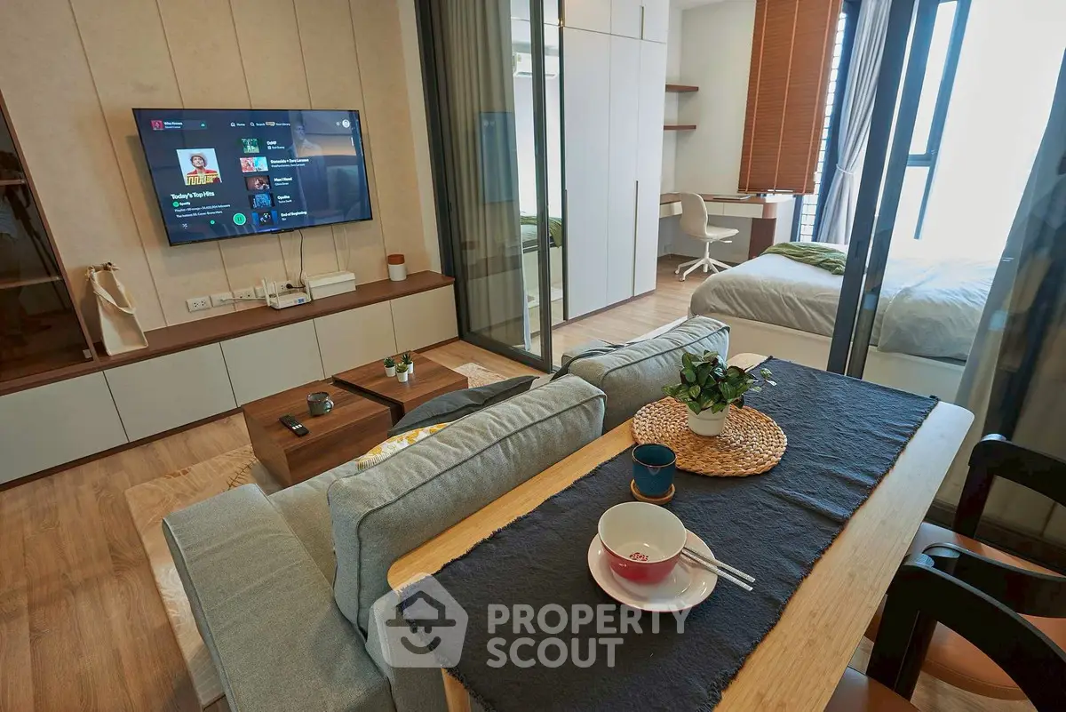 Modern open-plan living room with stylish decor and natural light