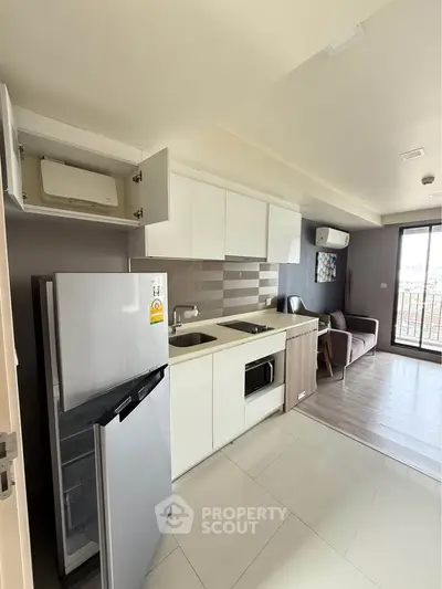 Modern kitchen with sleek appliances and open layout in a stylish apartment