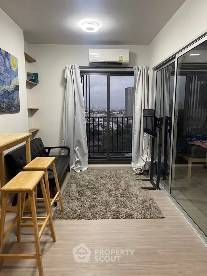 Modern living room with balcony view in urban apartment