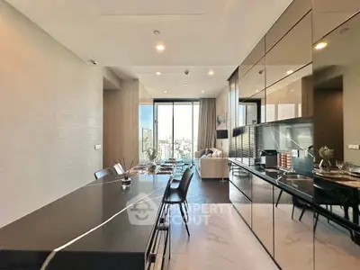 Luxurious open-plan living and dining area with modern kitchen and stunning city view.