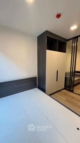 Modern bedroom with sleek wardrobe and minimalist design