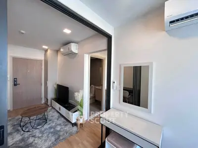 Modern living room with stylish decor and air conditioning in a cozy apartment.