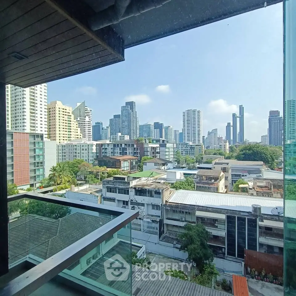 Stunning cityscape view from a modern balcony in a high-rise building, showcasing urban living at its finest.