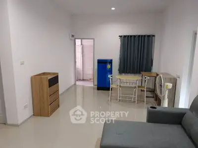 Spacious living room with modern furniture and sleek tiled flooring