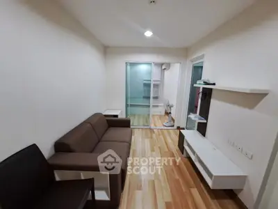 Modern living room with sleek furniture and wooden flooring