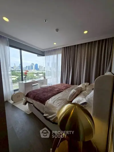 Luxurious bedroom with stunning city view and modern decor in high-rise apartment.