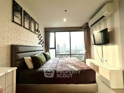 Luxurious bedroom with city view, modern decor, and ample natural light in a high-rise apartment.