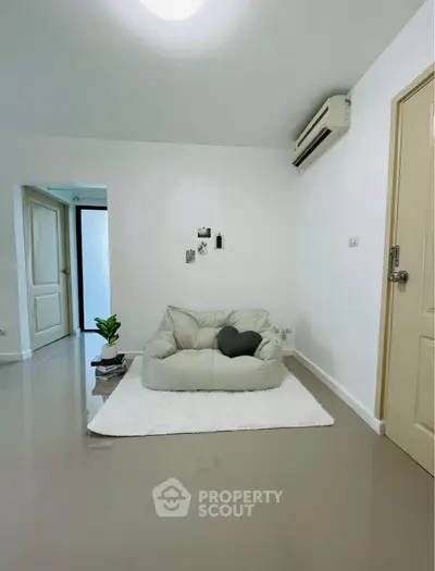 Minimalist living room with cozy seating and modern decor