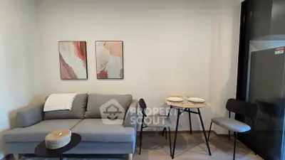 Modern living room with stylish decor and cozy seating area, perfect for relaxation and entertaining.