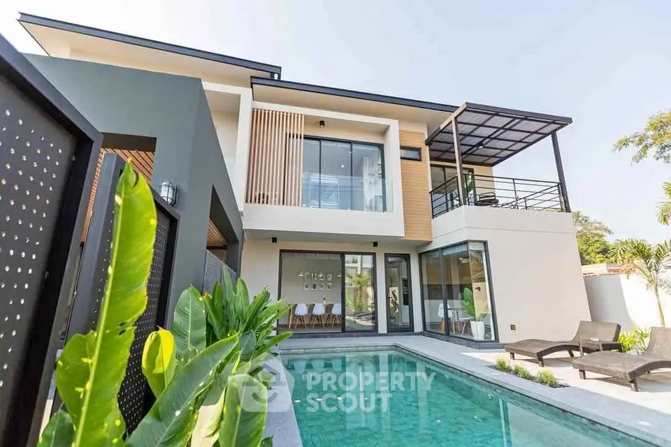 Modern luxury home with pool and spacious balcony, perfect for relaxation and entertainment.