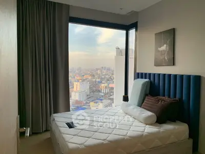 Modern bedroom with stunning city view from large corner window