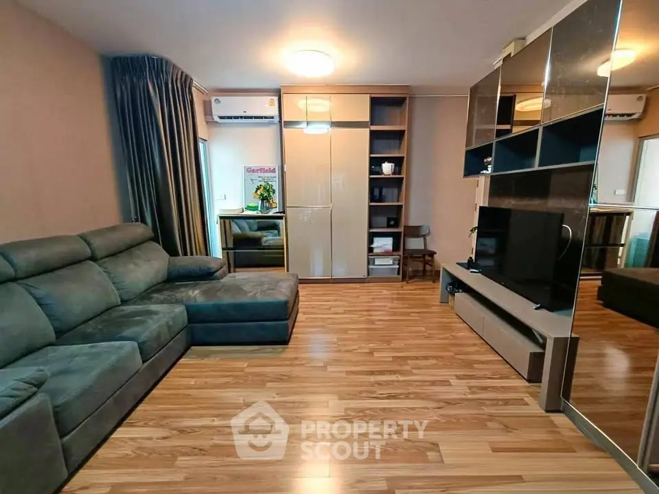 Spacious modern living room with sleek furniture and wooden flooring