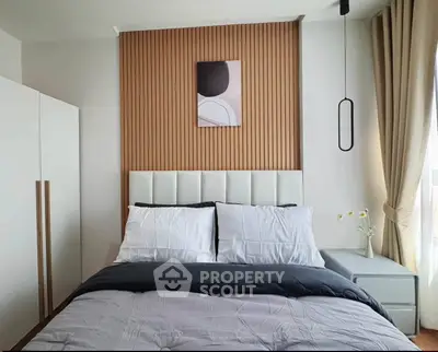 Modern bedroom with stylish decor and natural light