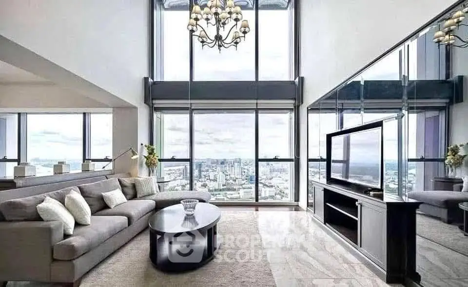 Luxurious high-rise living room with panoramic city views and elegant decor.