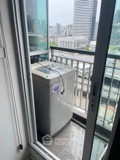 City view balcony with washing machine in modern high-rise apartment