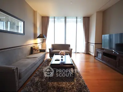 Luxurious living room with elegant furniture and large windows offering natural light.