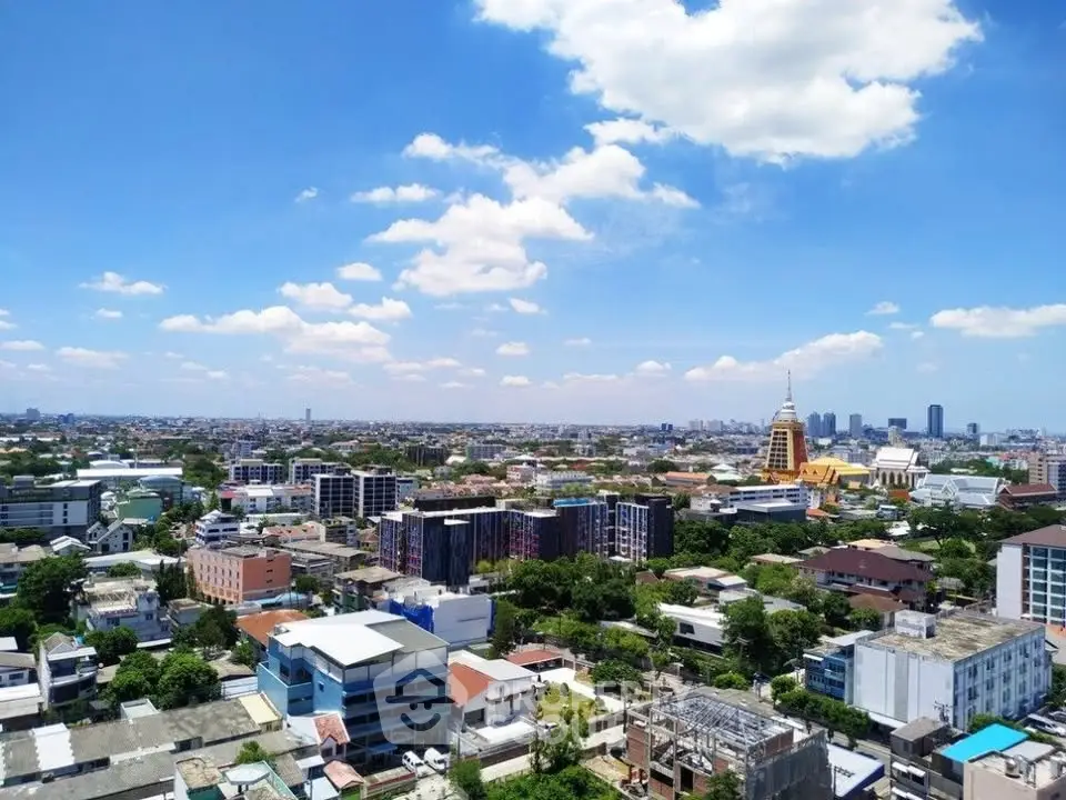 Stunning cityscape view showcasing vibrant urban landscape under a clear blue sky.