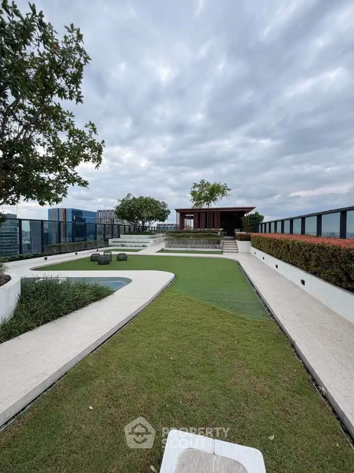 Stunning rooftop garden with panoramic city views and lush greenery.
