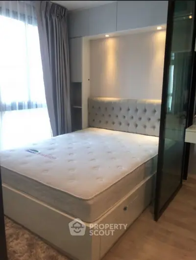 Modern bedroom with elegant headboard and natural light