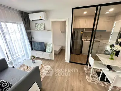Modern living room with open kitchen and stylish decor in a bright apartment