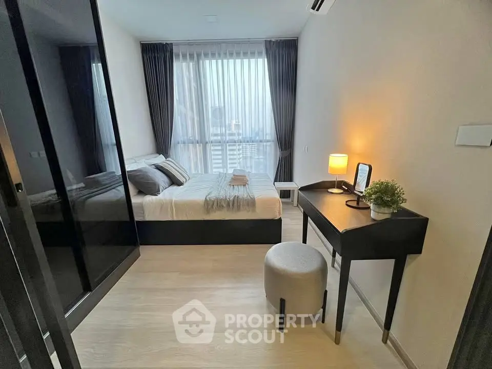 Modern bedroom with city view, featuring sleek furniture and elegant decor, perfect for urban living.