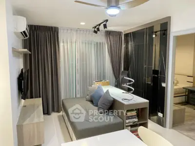 Modern living room with stylish decor and cozy seating area, perfect for relaxation and entertainment.