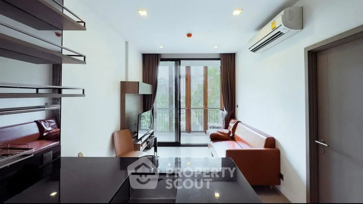 Modern living room with sleek design and balcony view