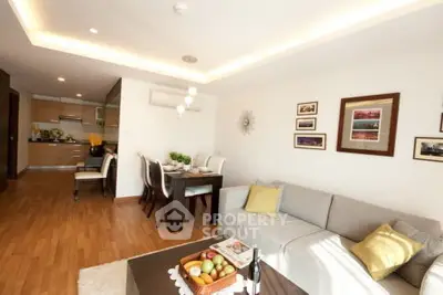 Spacious modern living room with open kitchen and elegant dining area