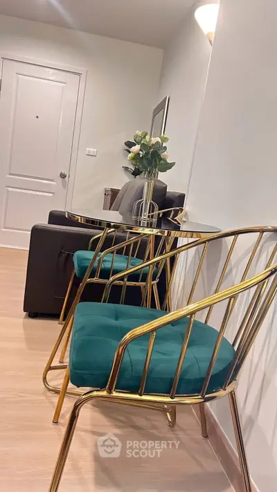 Stylish modern living room with elegant gold chairs and plush seating