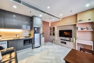 Modern open-plan living room with sleek kitchen and stylish decor