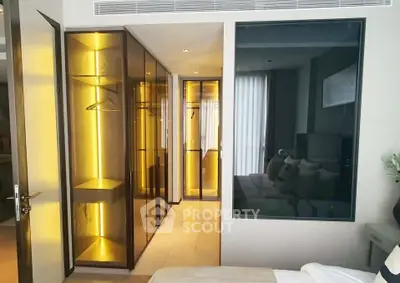 Luxurious bedroom with modern glass wardrobe and ambient lighting