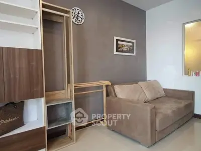 Cozy living room with modern sofa and stylish wall decor