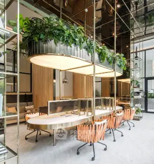 Luxurious modern co-working space with elegant design and greenery accents.