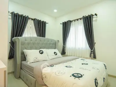 Cozy bedroom with elegant gray curtains and plush bed in modern home