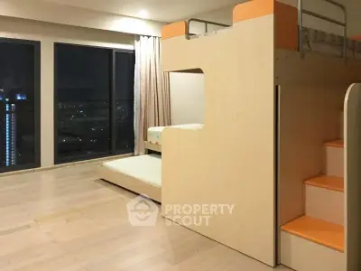 Modern bedroom with bunk bed and city view, featuring sleek wooden flooring and large windows.